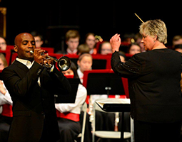 Raeleen pictured here with Tage Larsen - Trumpet - Chicago Symphony Orchestra - and her Palatine High School Symphonic Band as they performed The Haydn Trumpet Concerto.